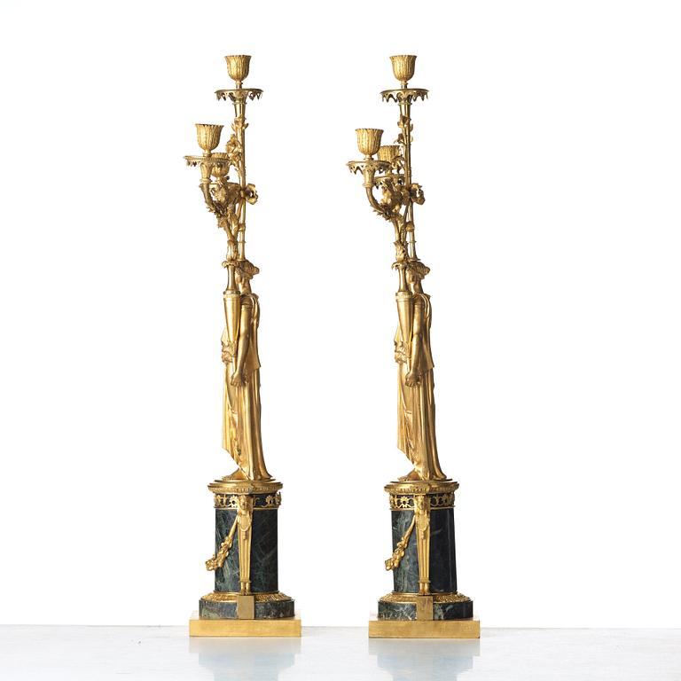 A pair of French Directoire three-light candelabra, circa 1800.