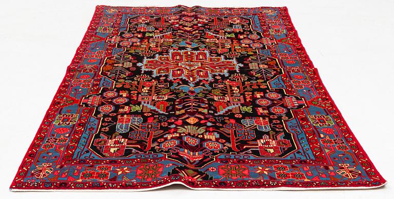 An oriental rug, ca 247 x 146-156 cm.