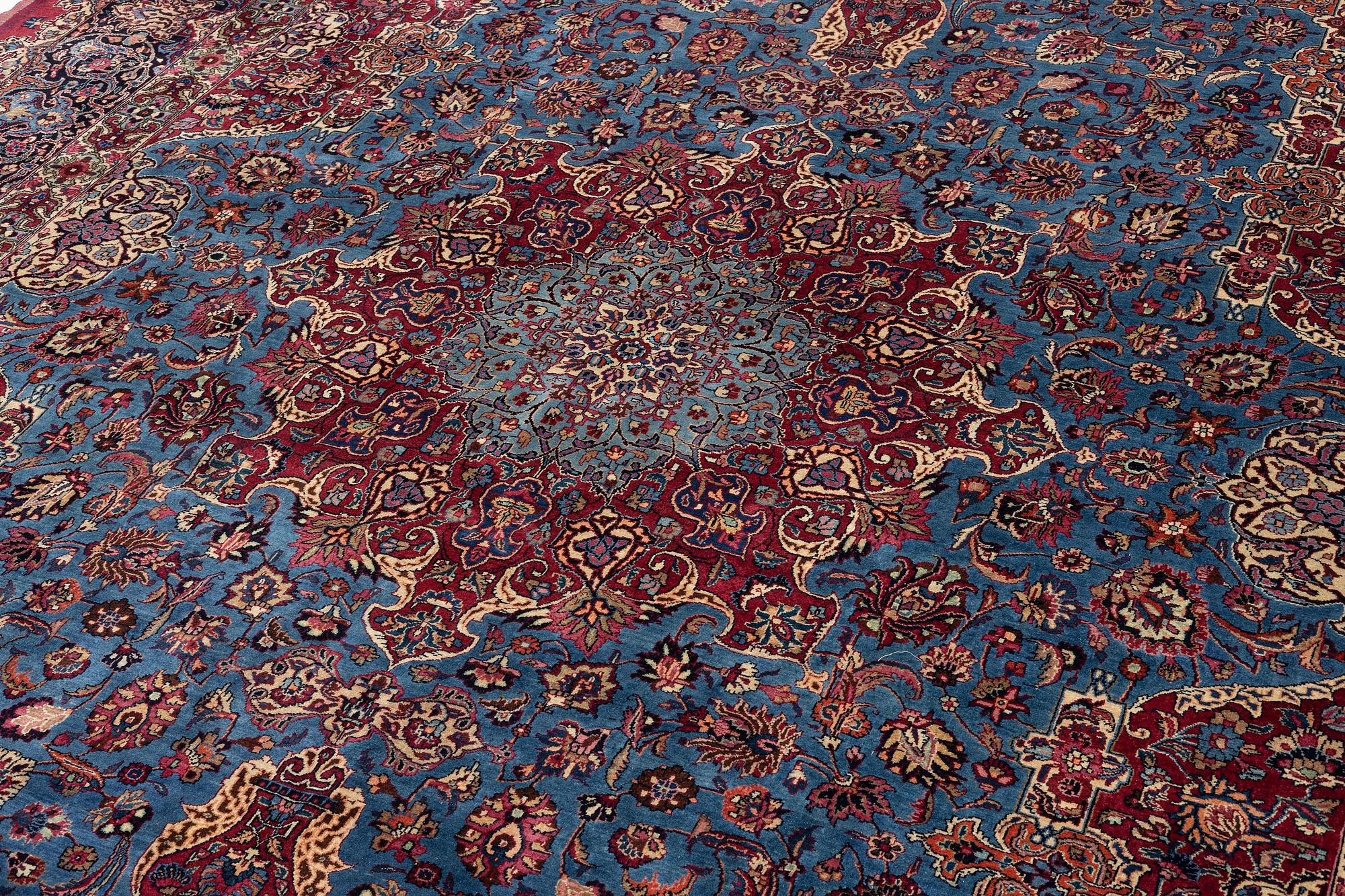 A Mashad carpet, signed Saber, c. 468 x 348 cm.