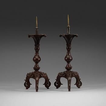 A pair of bronze candlesticks, presumably Ming dynasty (1368-1644).