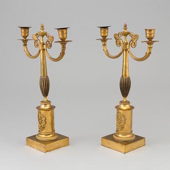 A pair of early 19th century ormolu candlestick.