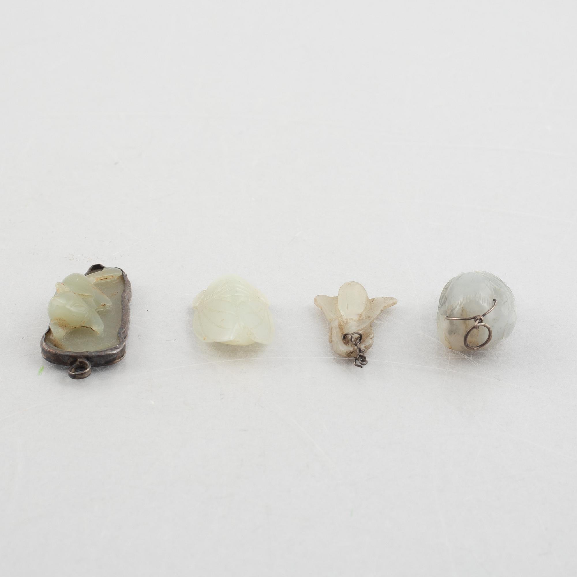 A group of eight Chinese stone charms / pendants, 20th century.