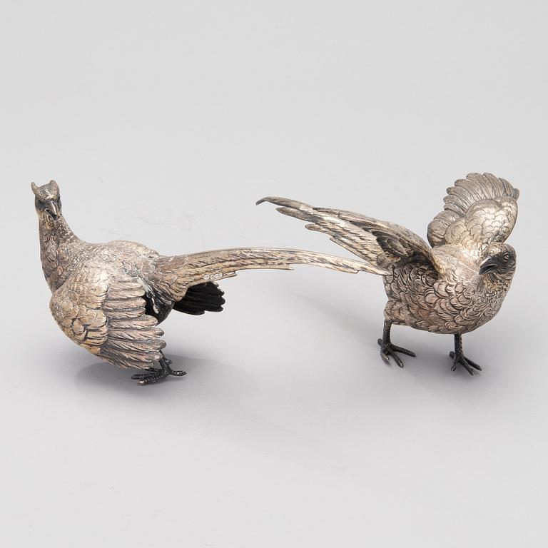 Two bird table decorations in silver, German and British hallmarks.