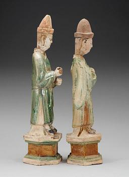 Two green and yellow glazed potted figures of Dignitaries, Ming dynasty.