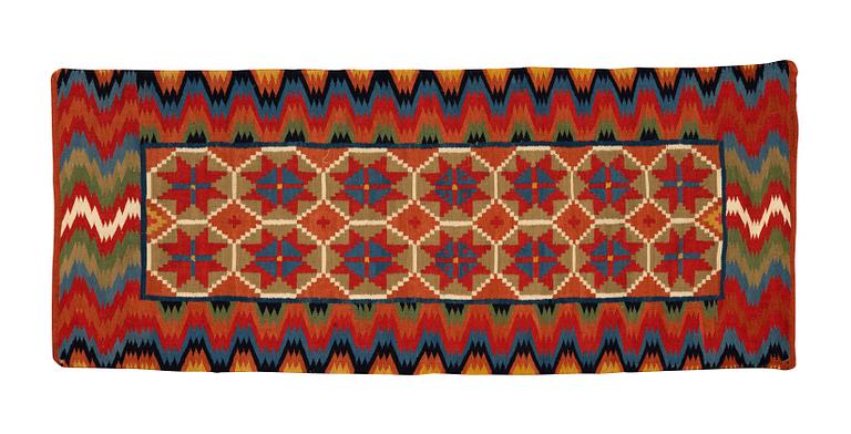 A carriage cushion, double-interlocked tapestry, ca 109,5 x 46 cm, Scania, Sweden.