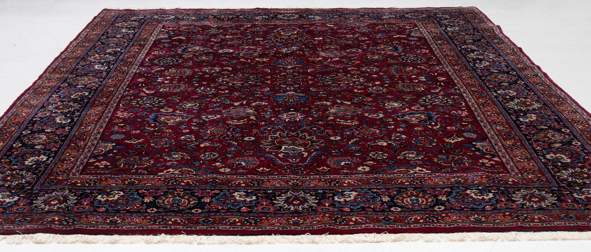 A Meshed carpet, c. 393 x 305 cm.