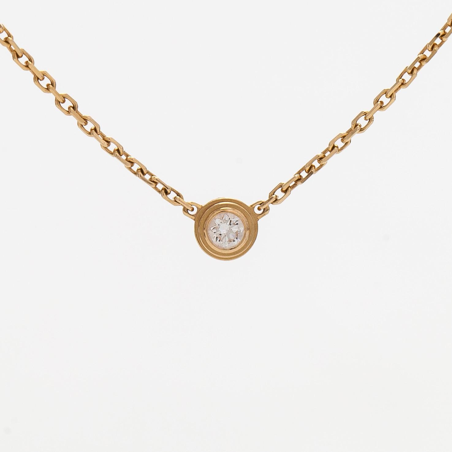 Cartier, an 18K gold 'd'Amour' necklace, with a brilliant-cut diamond.