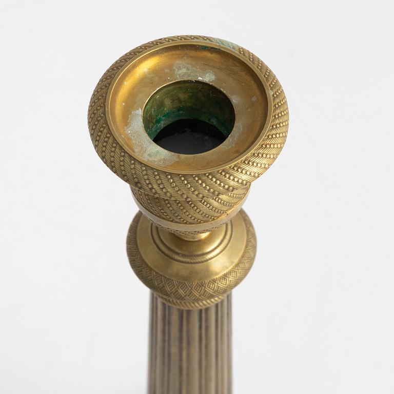 A brass Empire candlestick, first half of the 19th century,