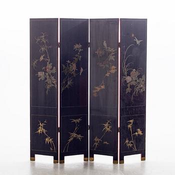 A Chinese lacquered folding screen, 20th century.