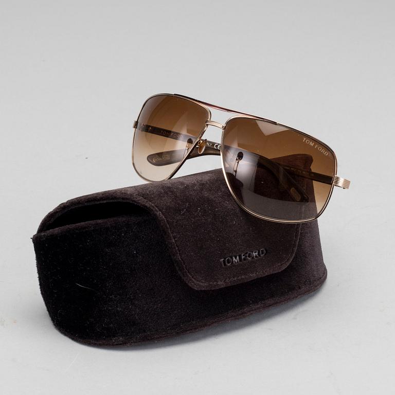 Two pair of Tom Ford Sunglasses.