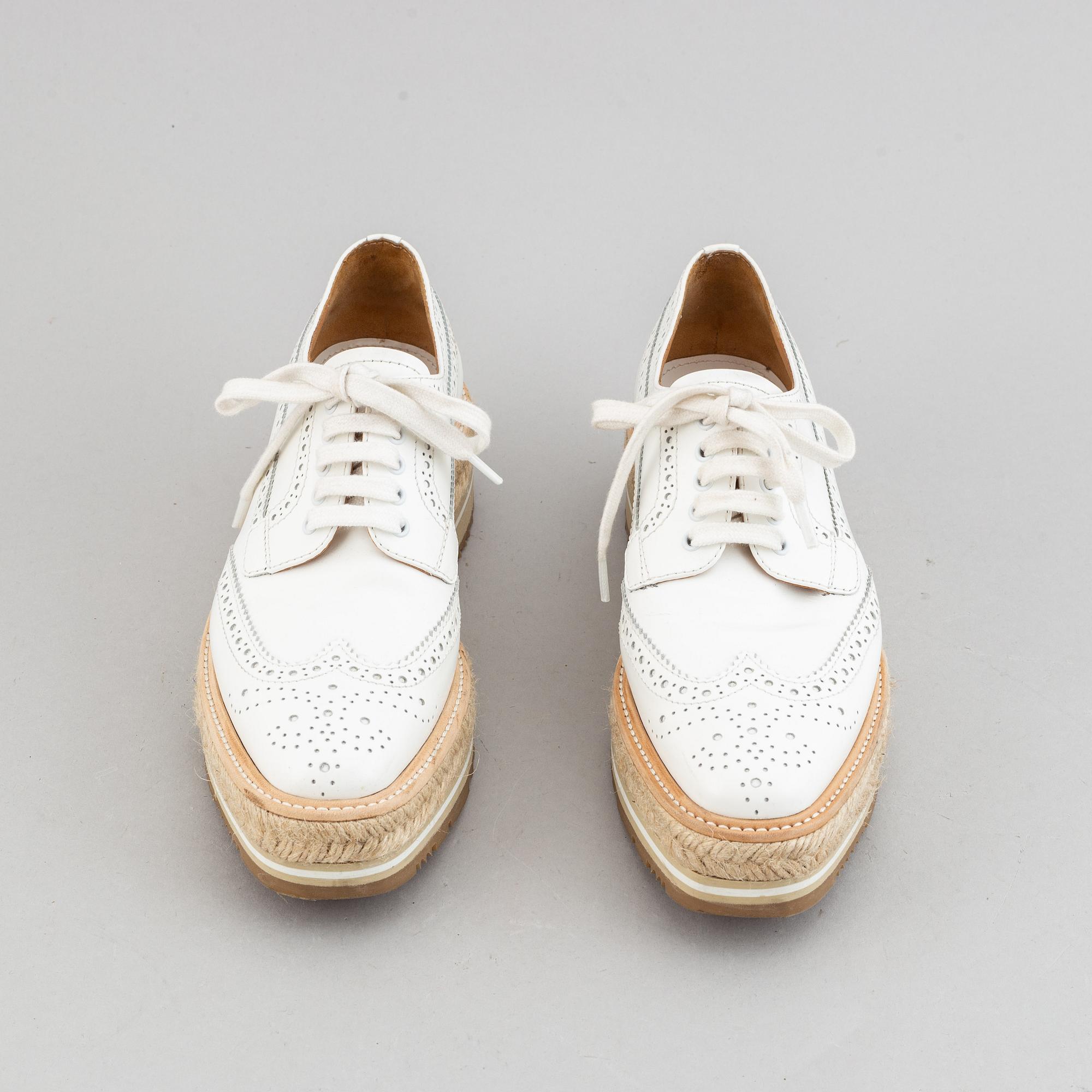 Prada, a pair of white leather brogues, size 36.