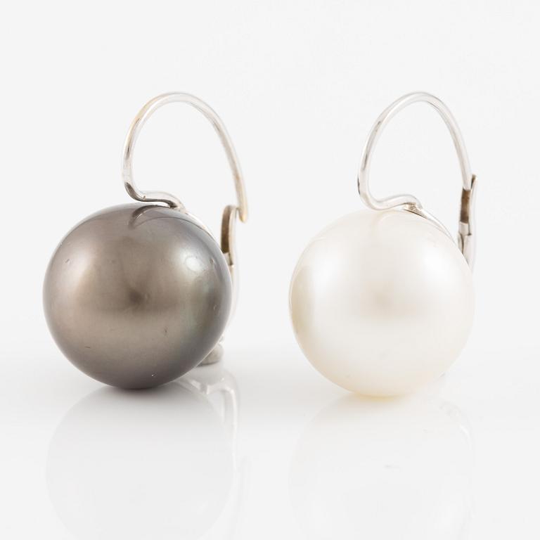 Earrings with cultured Tahitian and South Sea pearls.