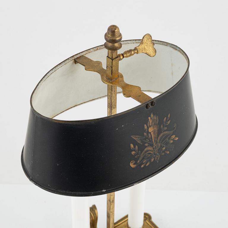 A gilt brass candlestick, 20th Century with older parts.