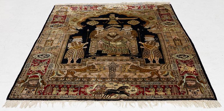 A pictorial semi-antique silk Qum rug, central Persia, c. 214 x 146 cm.