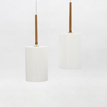 Uno & Östen Kristiansson, a pair of acrylic and oak ceiling lights, Lucus, Vittsjö.