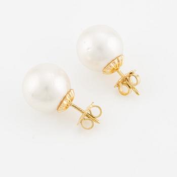 Earrings with cultured South Sea pearls.