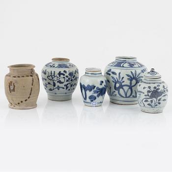 Five blue and white porcelain and ceramic urns, Ming dynasty, (1368-1644).