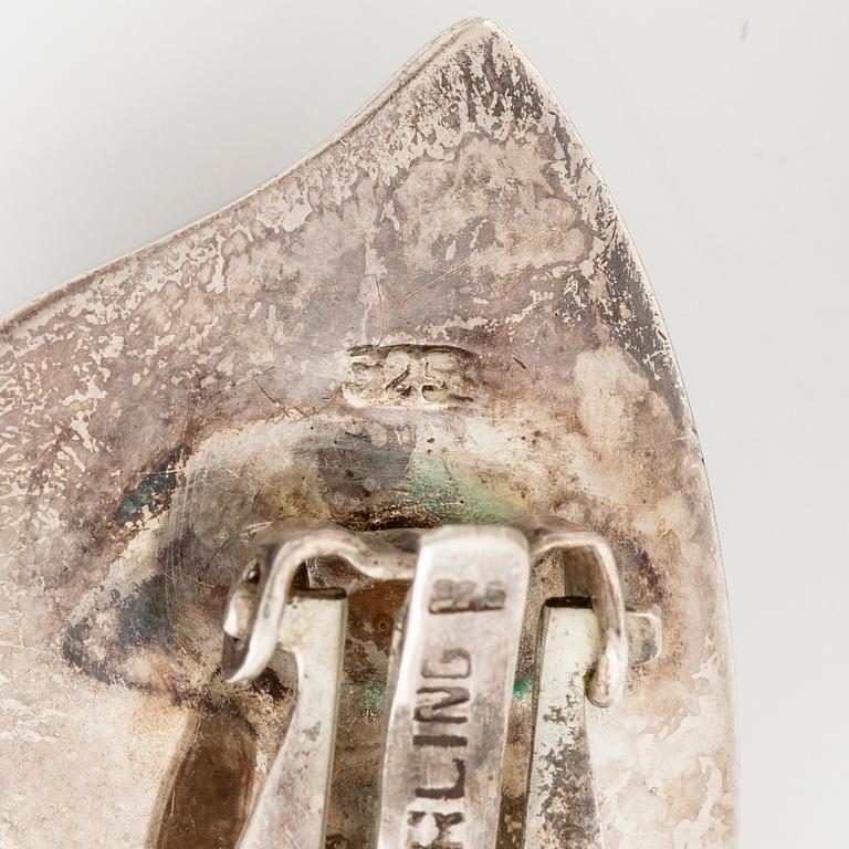 Earrings, silver, in the form of stylised leaves.