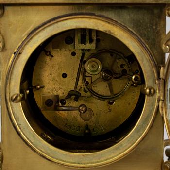 A brass mantle clock, early 20th century.