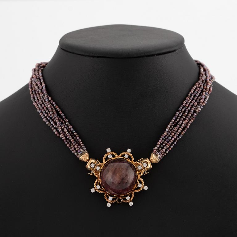 Necklace with seed pearls featuring two detachable clasps with carved coral, cabochon-cut tourmaline, and brilliant-cut diamonds.