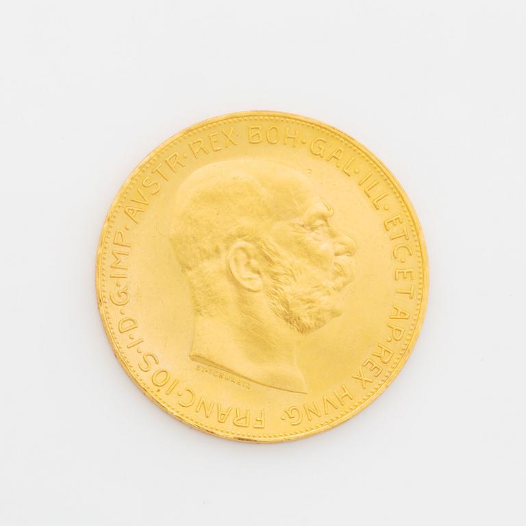 A Austrian gold coin, re-striked 100 Corona, 1915.
