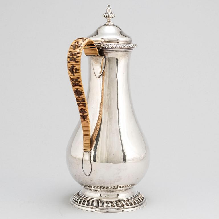 An English 18th century silver wine jug, mark of Augustin Le Sage, London 1770.