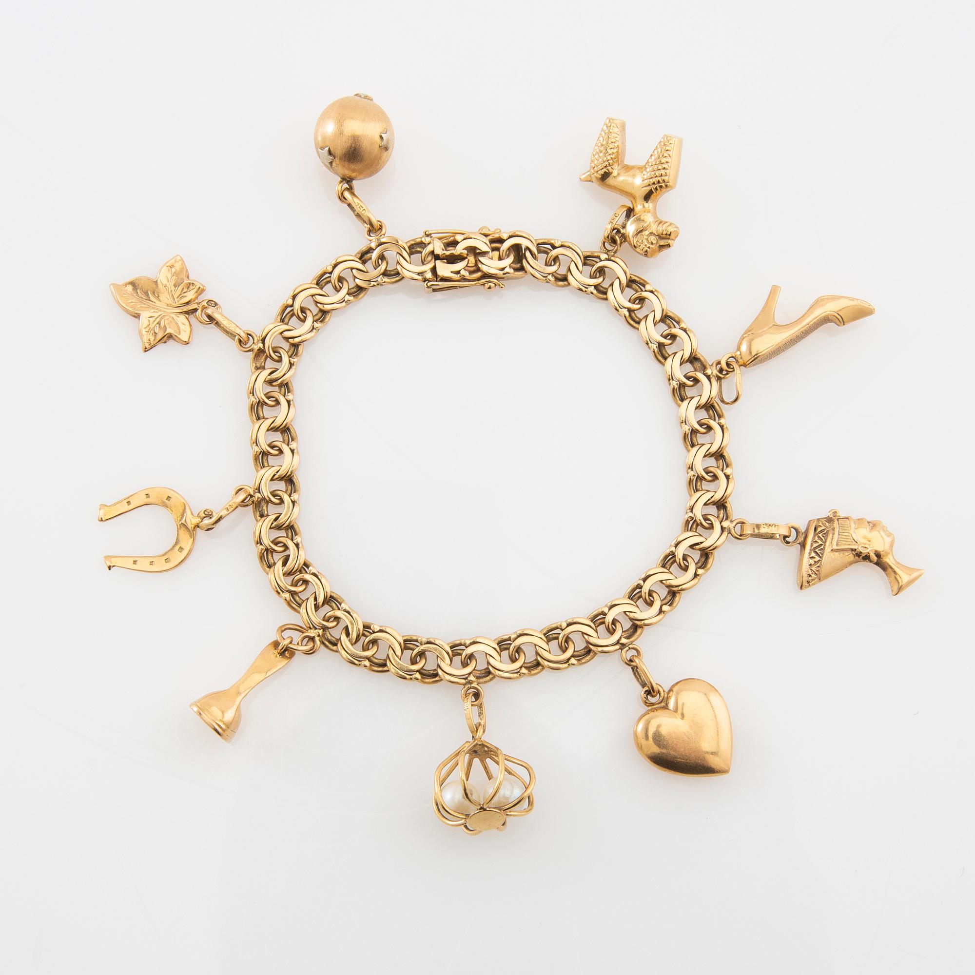 Bracelet Bismarck link 18K gold with charms.