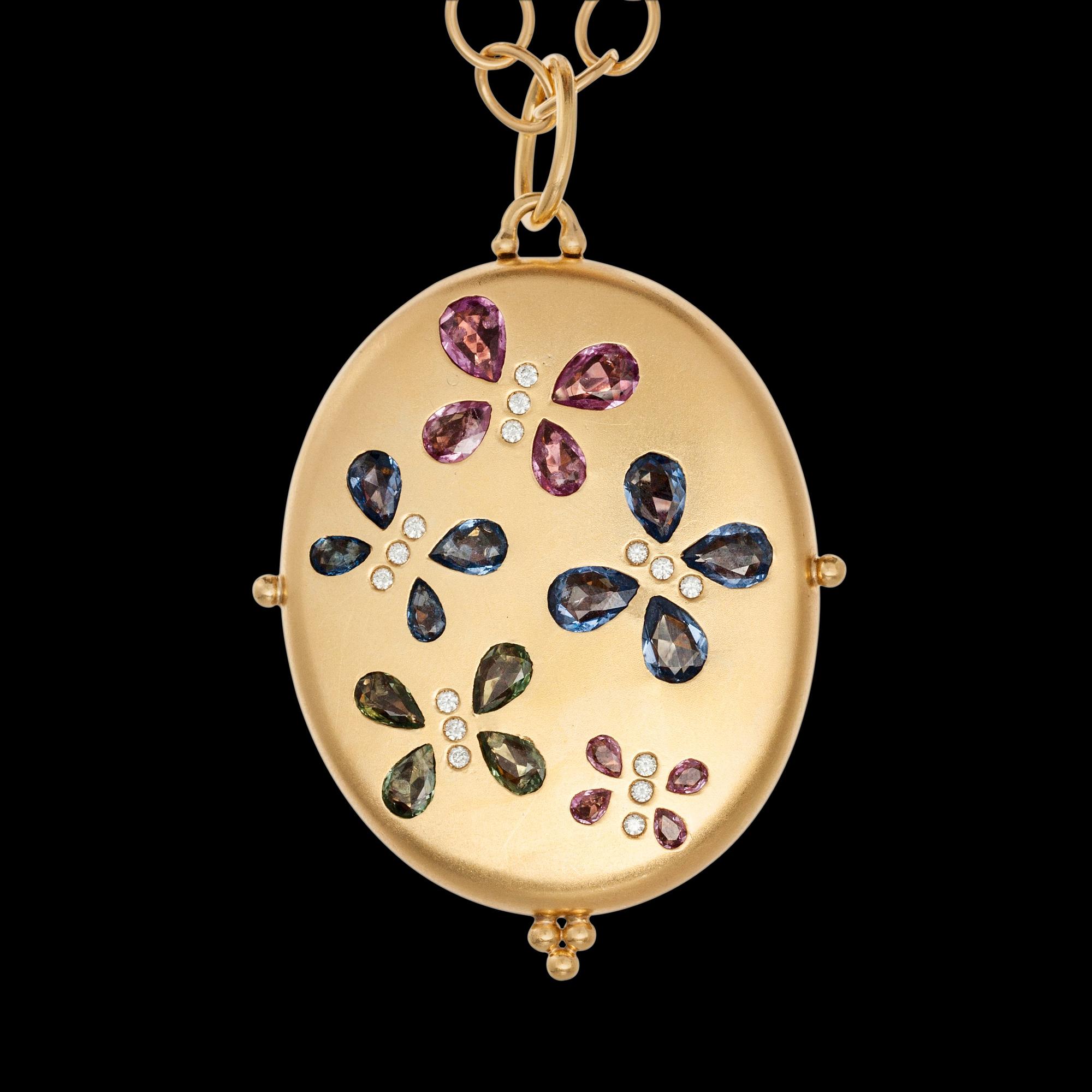 MEDALJONG, 18K guld, flerfärgade safirer, briljantslipade diamanter ca 0,20 ct. TEMPLE ST. CLAIR, USA. Vikt 75,3 g.
