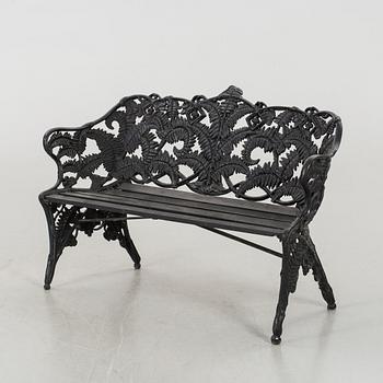 A MELINS GARDEN SOFA.