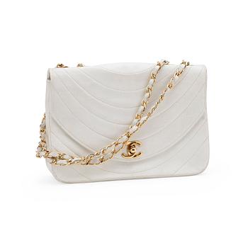 CHANEL, a white leather shoulder bag.