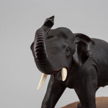 A Japanese bronze sculpture of an elephant, 20th Century. Signed.