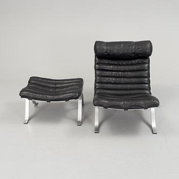 A black leather "Ari" easy chair with foot stool by Arne Norell for Norell möbler.