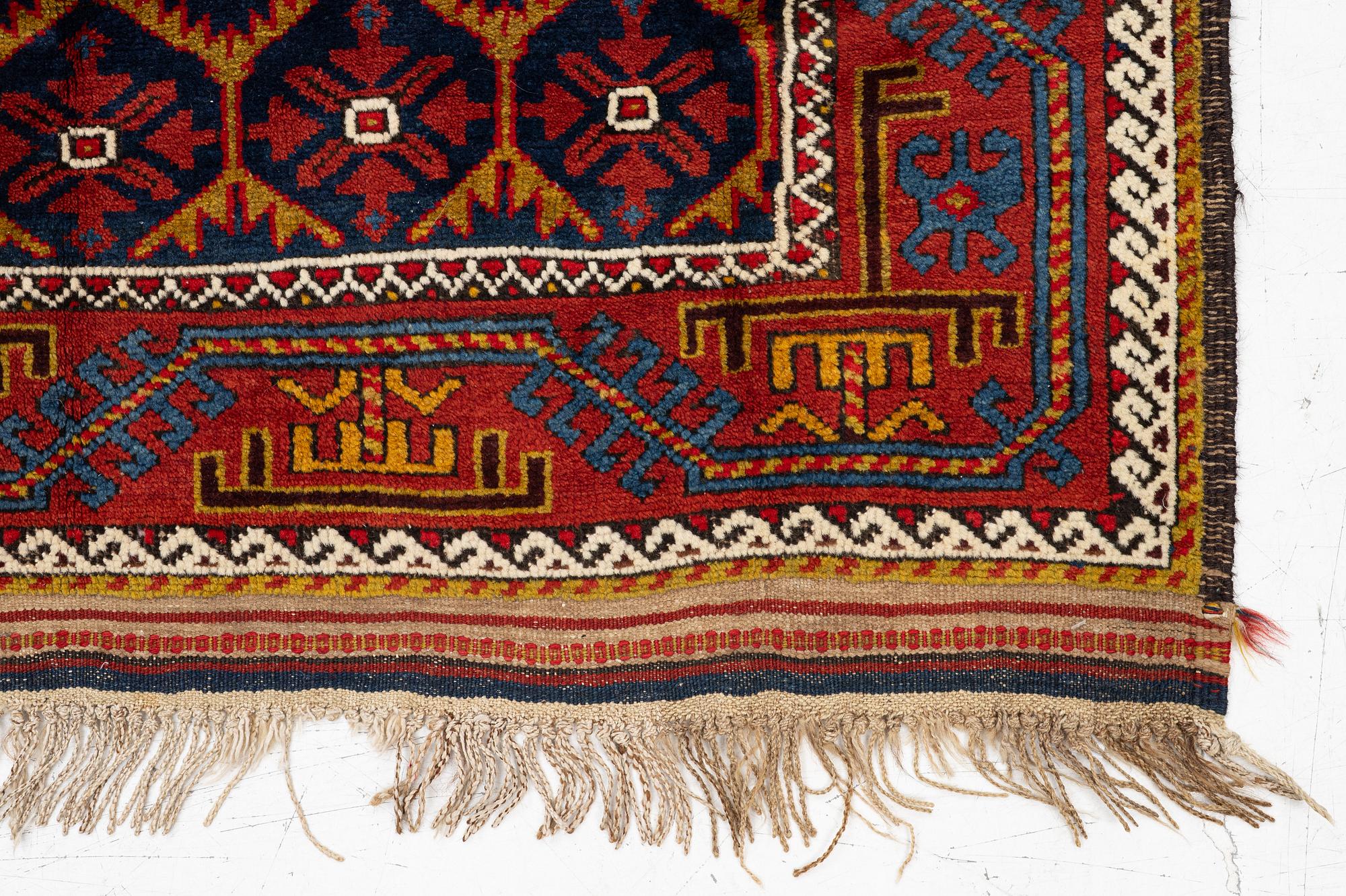 An antique Baluch rug, east Persian, ca 203 x 101 cm.