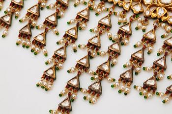 An Indian demi parure comprising a necklace and a pair of earrings.