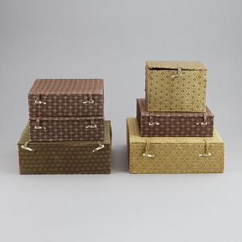 A set of six silk clad boxes, China, 20th Century.