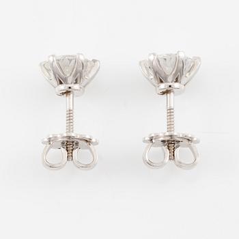 Brilliant-cut diamond stud earrings.