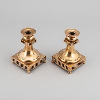 A pair of Gusum brass chandelabras, Sweden, 20th Century.