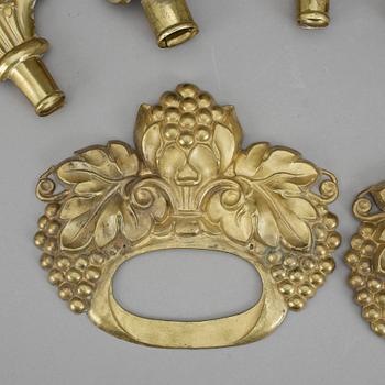 GARDINBESLAG. 10 delar. Mässing. Empire, 1800-talets första hälft.