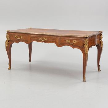 A French Louis XV-style rosewood marquetry 'Bureau plat aux bustes de femmes", late 19th century.