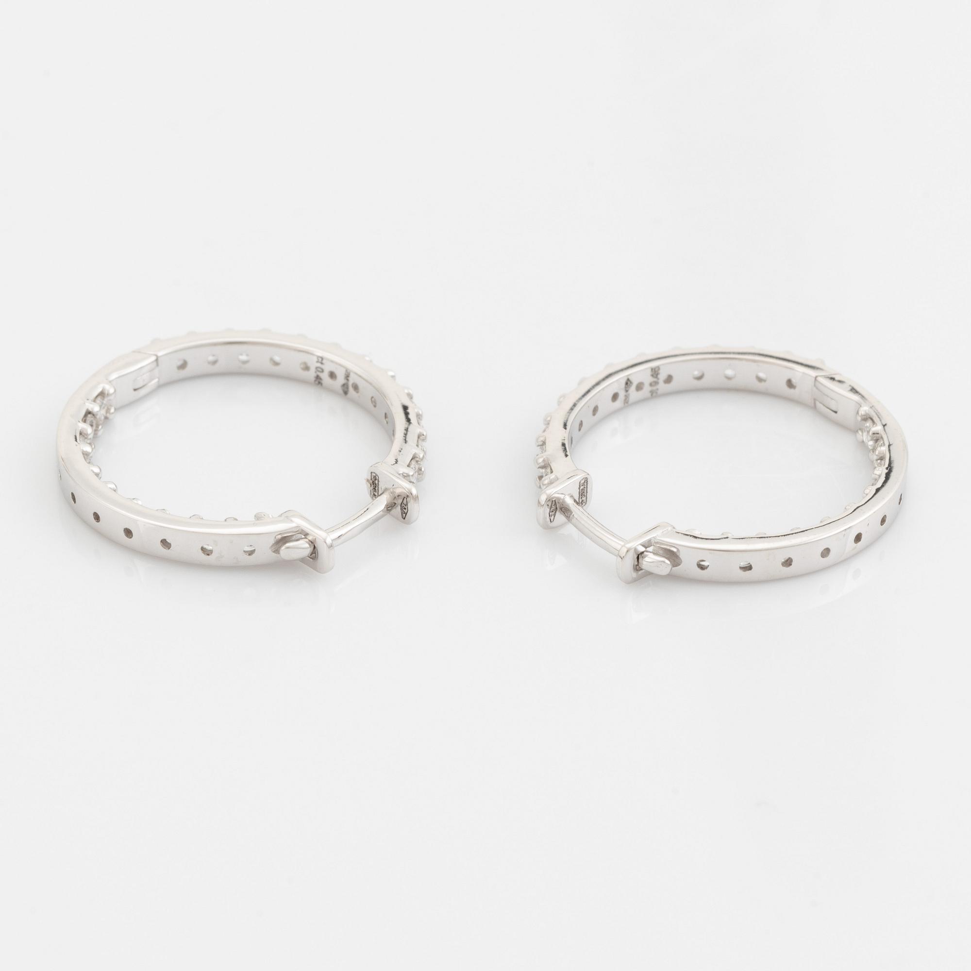 Brilliant cut diamond hoop earrings.