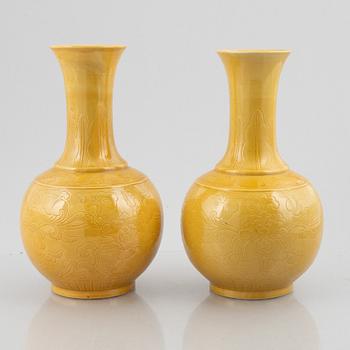 Two Chinese yellow glazed ceramic vases, 20th century.