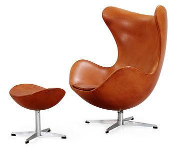 57. An Arne Jacobsen brown leather 'Egg' chair and ottoman, Fritz Hansen, Denmark 1963.