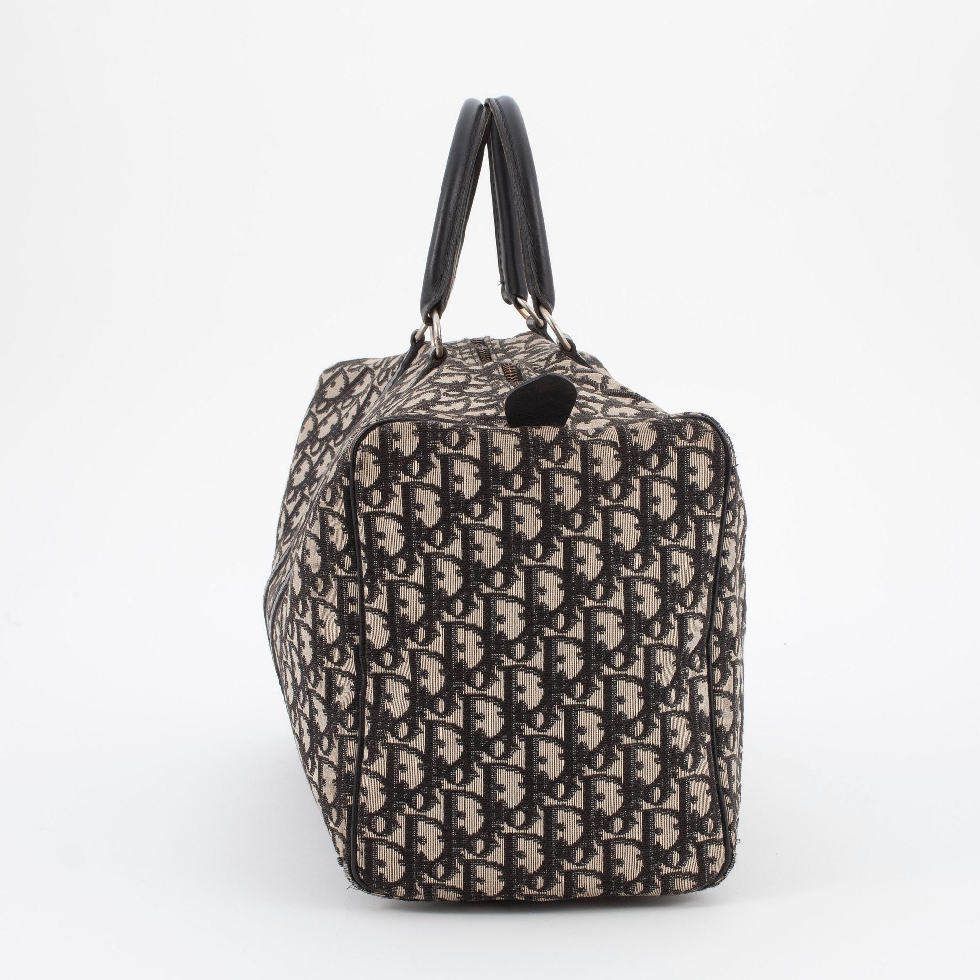 CHRISTIAN DIOR, a black monogram canvas bag.