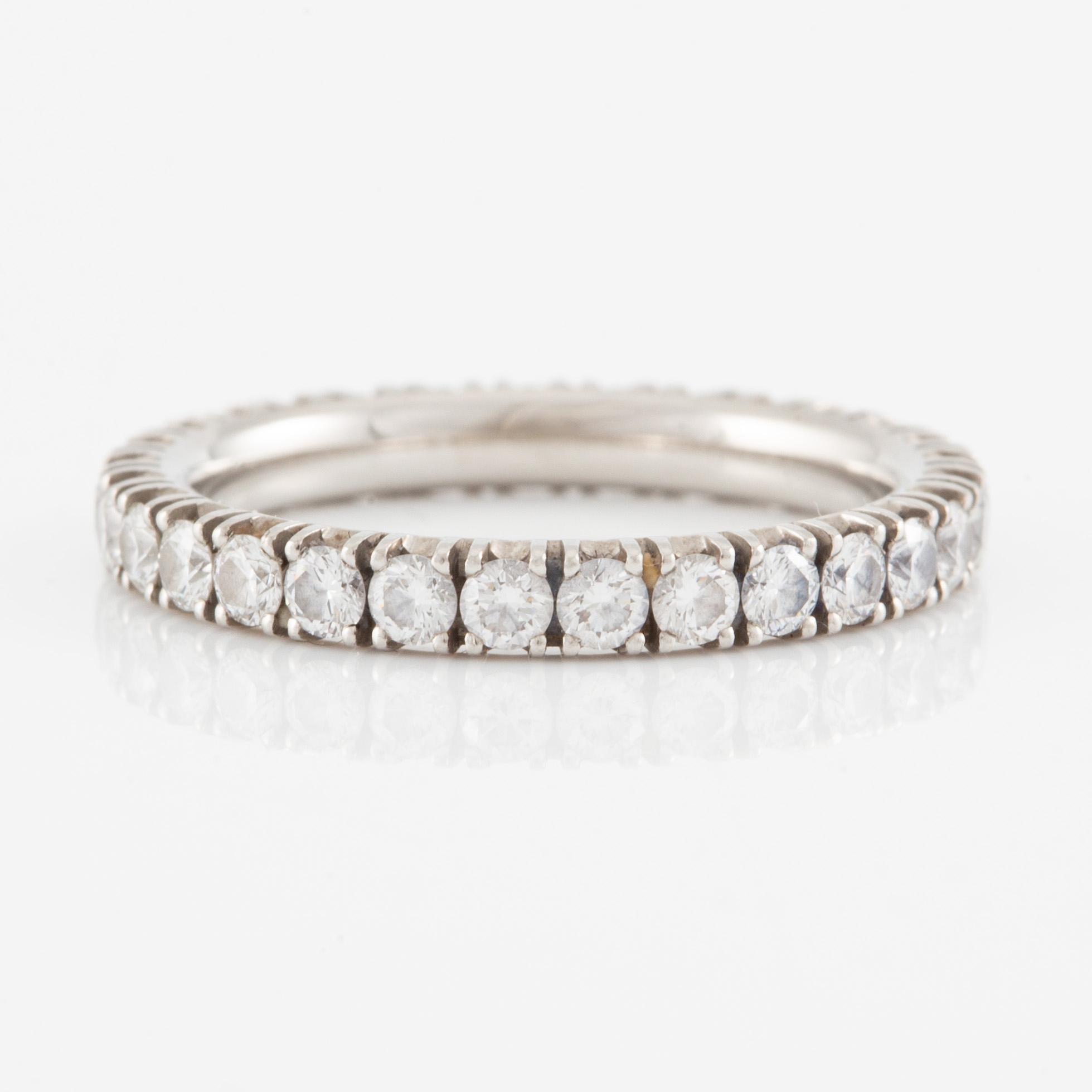 Cartier eternity ring in platinum with round brilliant-cut diamonds.