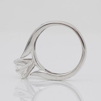 A pear-cut diamond, 1.57 cts, ring. GIA certificate. Pavé-set smaller diamonds on shank.