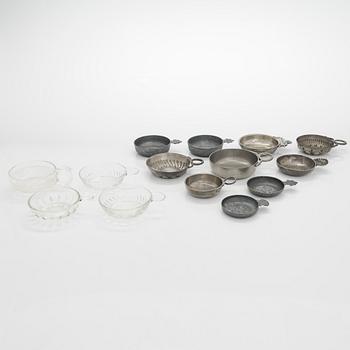 A set of fourteen taste du vin, pewter and glass, 20th century.