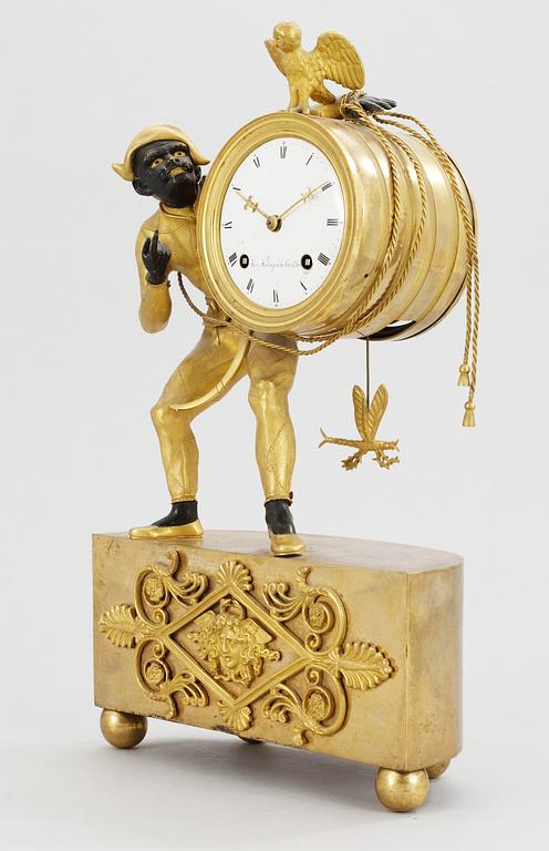 An Empire gilt bronze mantel clock by J. Holmgren.