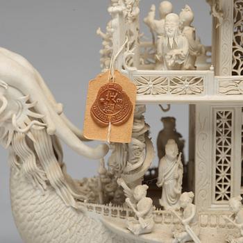 A biscuit porcelain dragon boat of 'Assembly of Immortals', Qing dynasty, Daoguang, signed Chen Guozhi, 19th century.