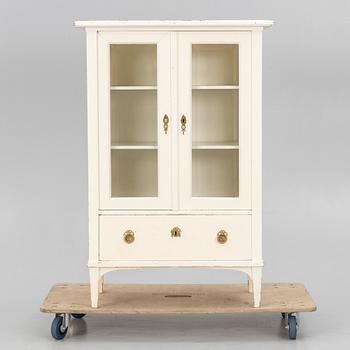 A display cabinet, early 20th century.