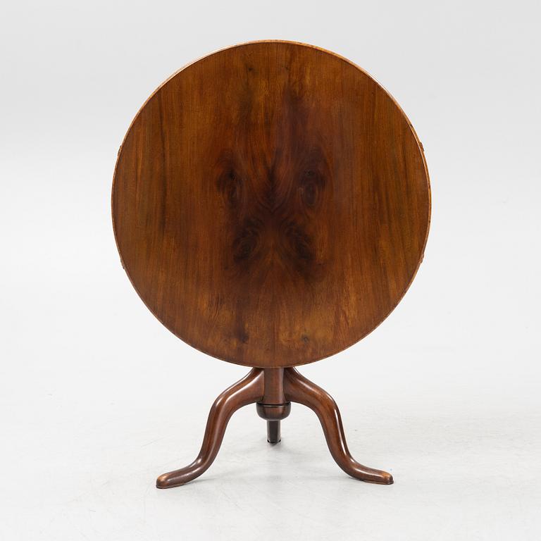 A tilt-top table.